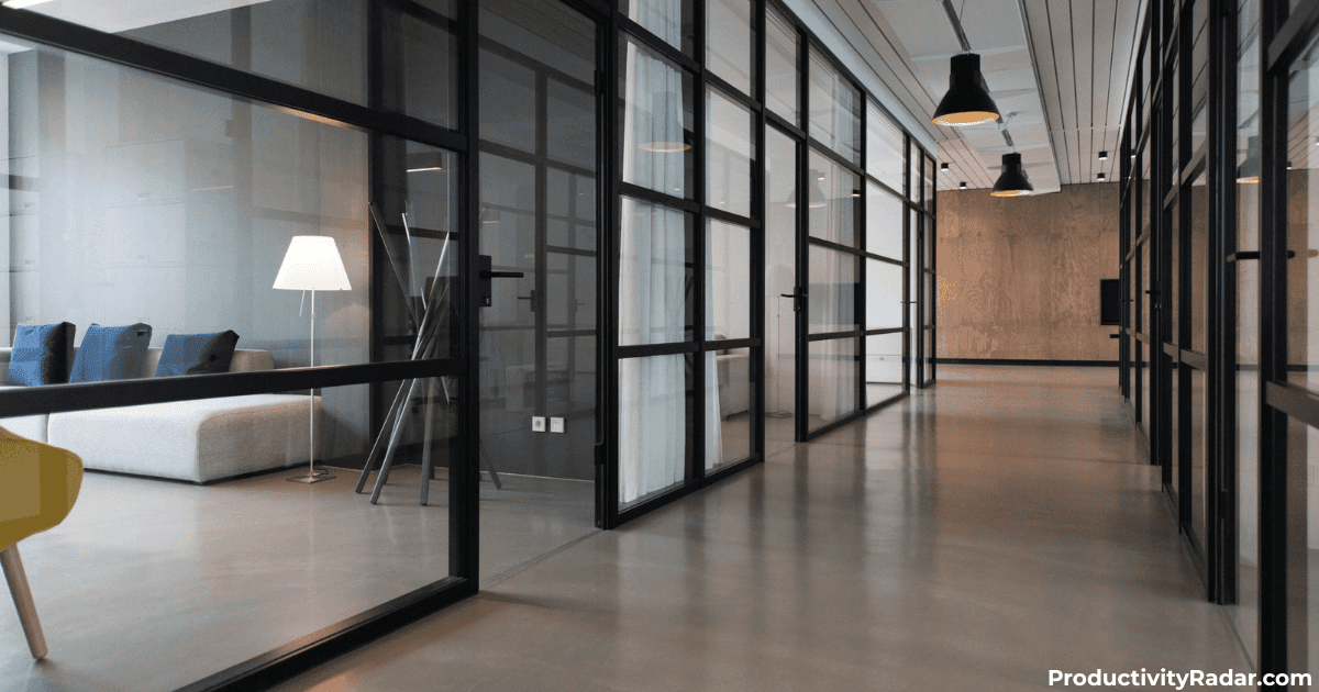 Modern office corridor with glass walls and industrial lighting - what to do when an employee disagrees with their review