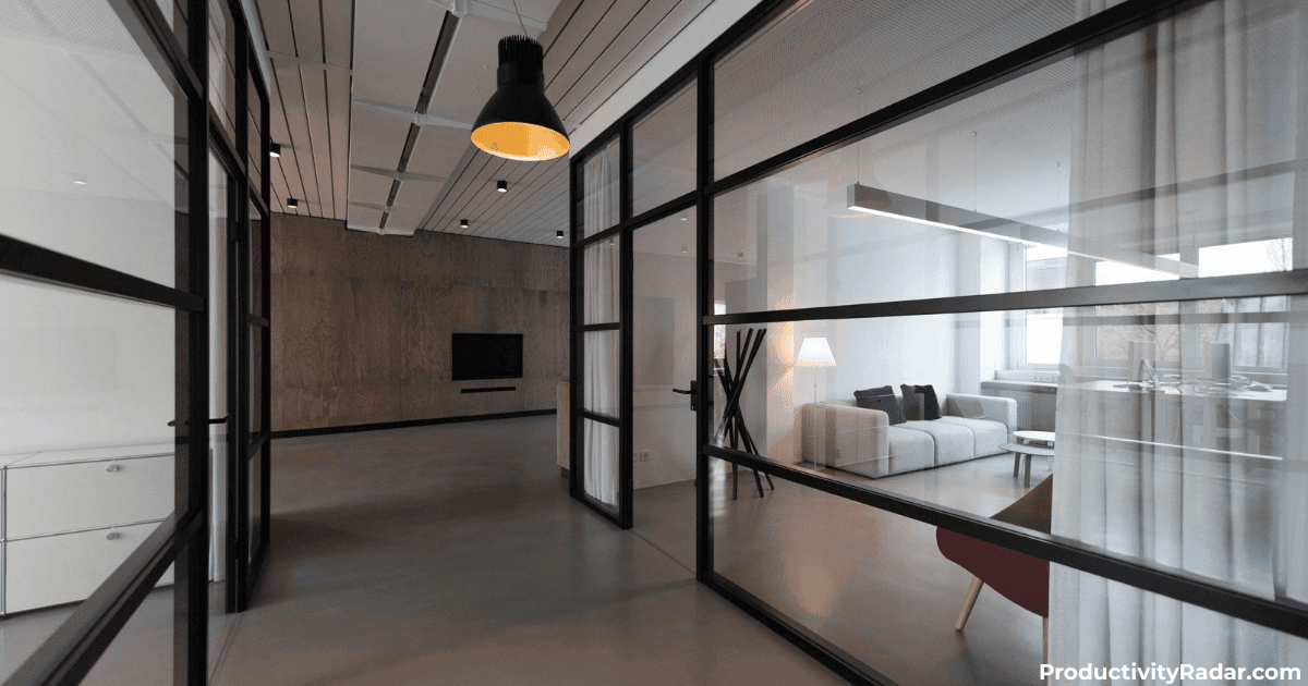 Glass-walled office with pendant lighting and private seating area - ChatGPT prompts for 1-on-1 meetings