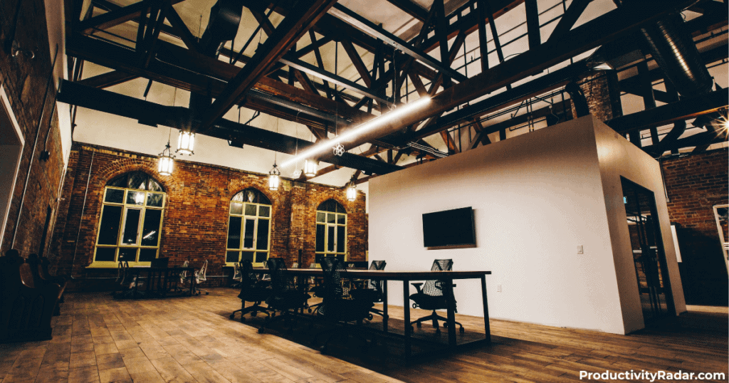 Loft office with exposed brick walls and steel beam ceiling - ChatGPT prompts for performance reviews